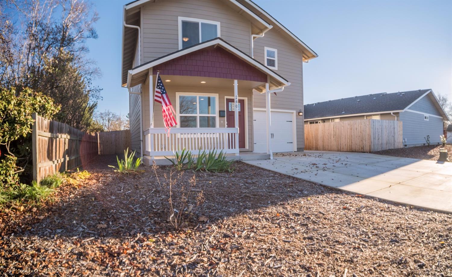 240 Maple Street Central Point, OR 97502 - Photo 1 of 35 a front view of a house with a yard and garage