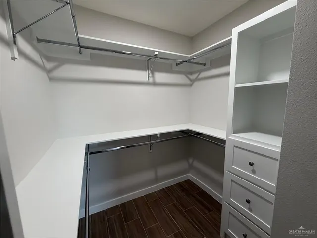 a view of storage and utility room with racks on the wall