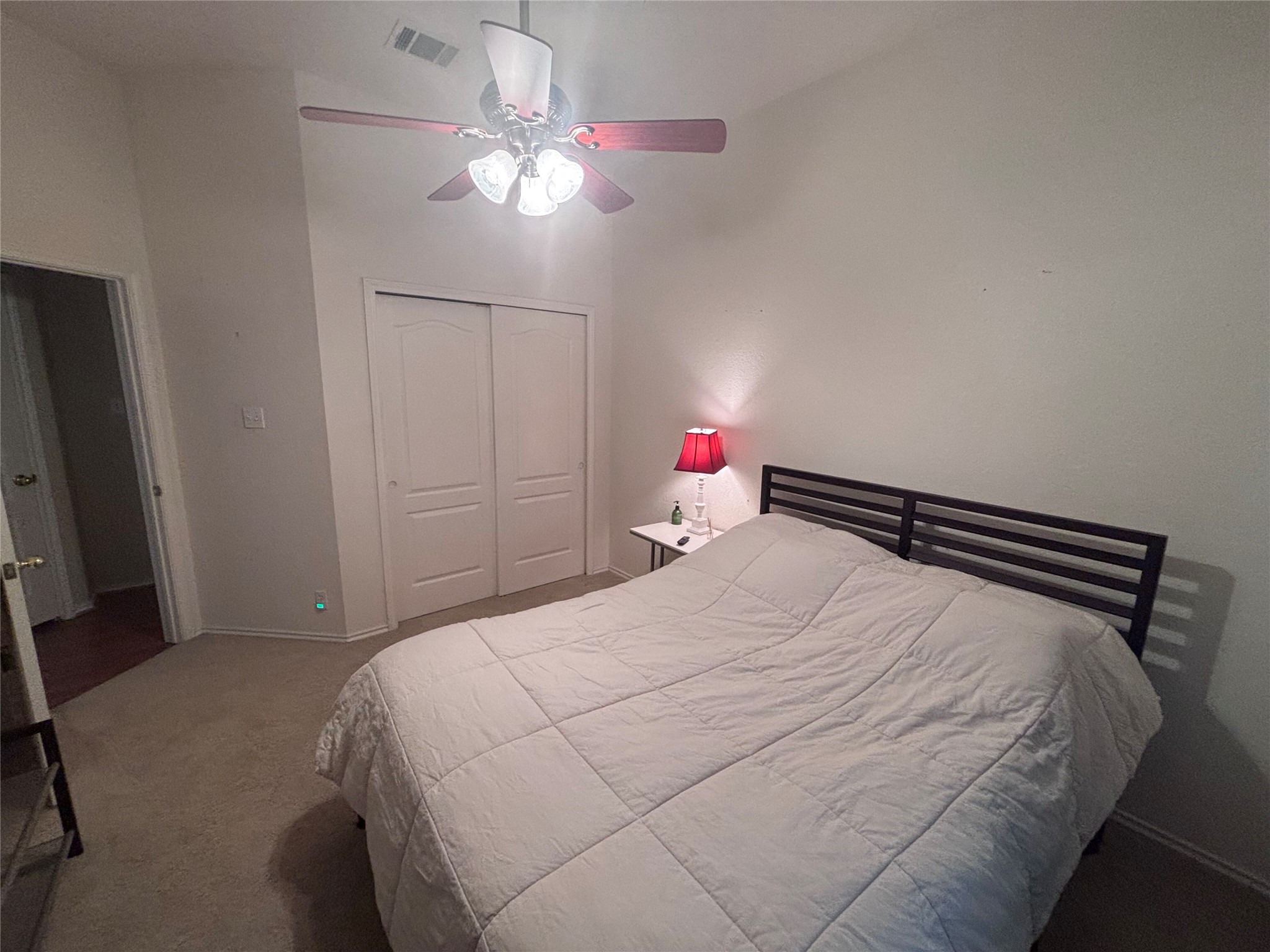 1316 Mesquite Road Cedar Park, TX 78613 - Photo 4 of 24 An inviting bedroom with plush carpet and a convenient sliding door closet, providing comfort and functionality.
