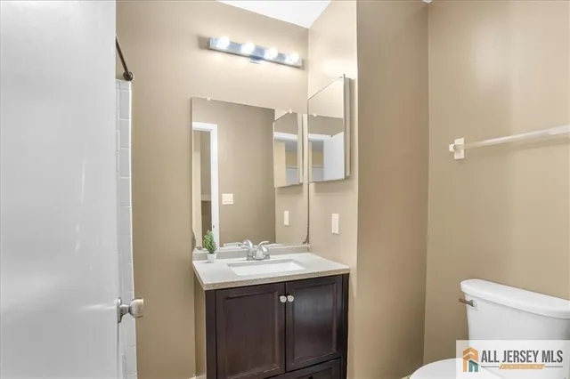 a bathroom with a sink and mirror