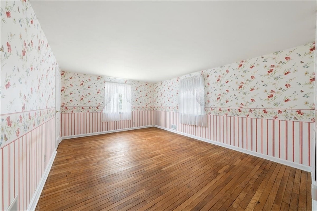 28 Barnesdale Road Natick, MA 01760 - Photo 22 of 33 a view of an empty room with wooden floor