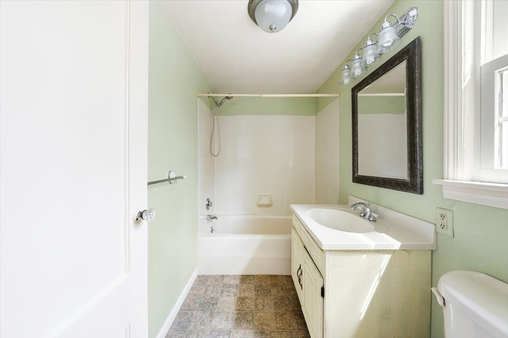 28 Barnesdale Road Natick, MA 01760 - Photo 30 of 33 a bathroom with a sink a toilet and shower