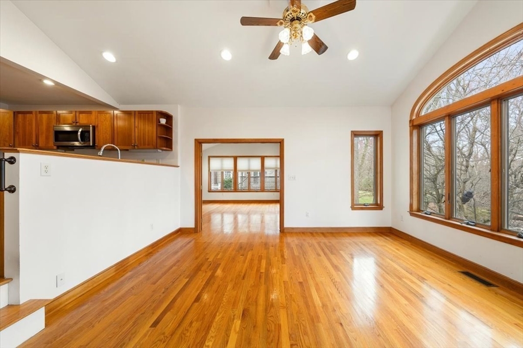 28 Barnesdale Road Natick, MA 01760 - Photo 3 of 33 a view of an empty room with a window and wooden floor