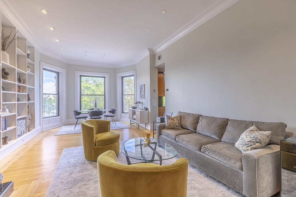 33 Bay State Road, Unit 3 Boston, MA 02215 - Photo 1 of 25 a living room with furniture and a large window