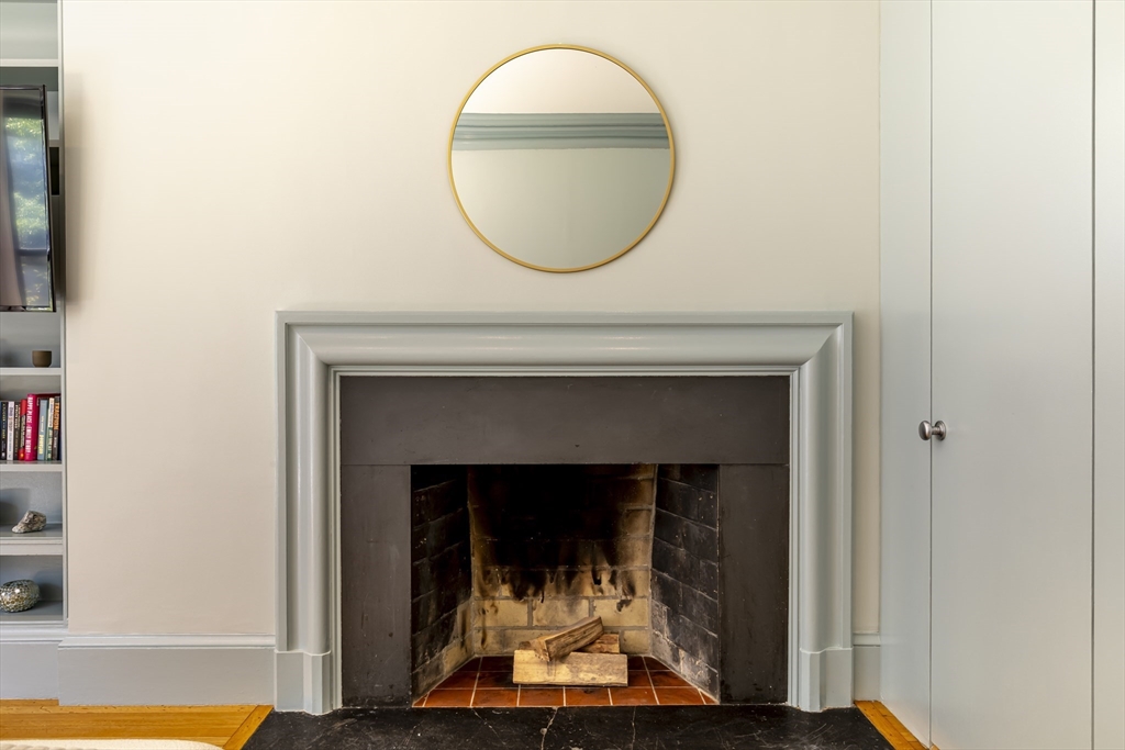 33 Bay State Road, Unit 3 Boston, MA 02215 - Photo 13 of 25 a living room with a fireplace