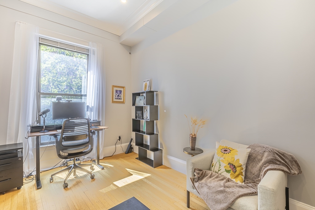 33 Bay State Road, Unit 3 Boston, MA 02215 - Photo 15 of 25 a view of a workspace with furniture and a window