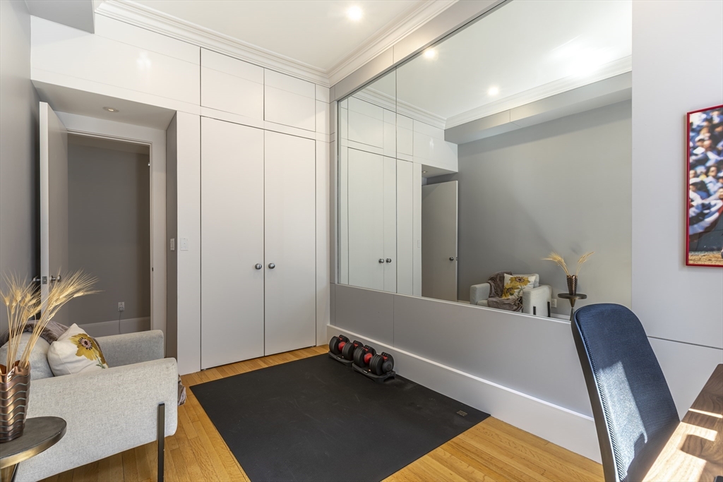 33 Bay State Road, Unit 3 Boston, MA 02215 - Photo 16 of 25 a room with furniture and a potted plant