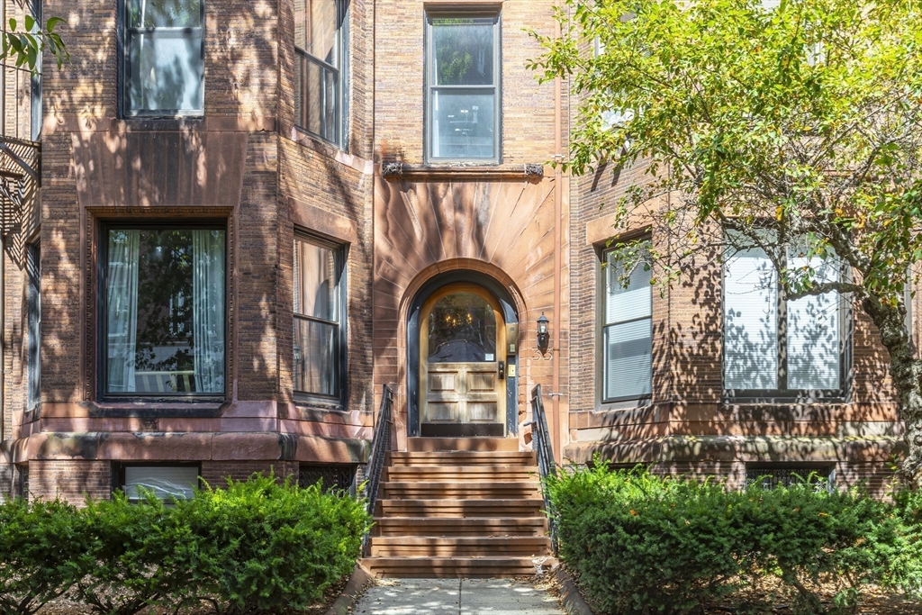 33 Bay State Road, Unit 3 Boston, MA 02215 - Photo 21 of 25 a front view of a house with garden
