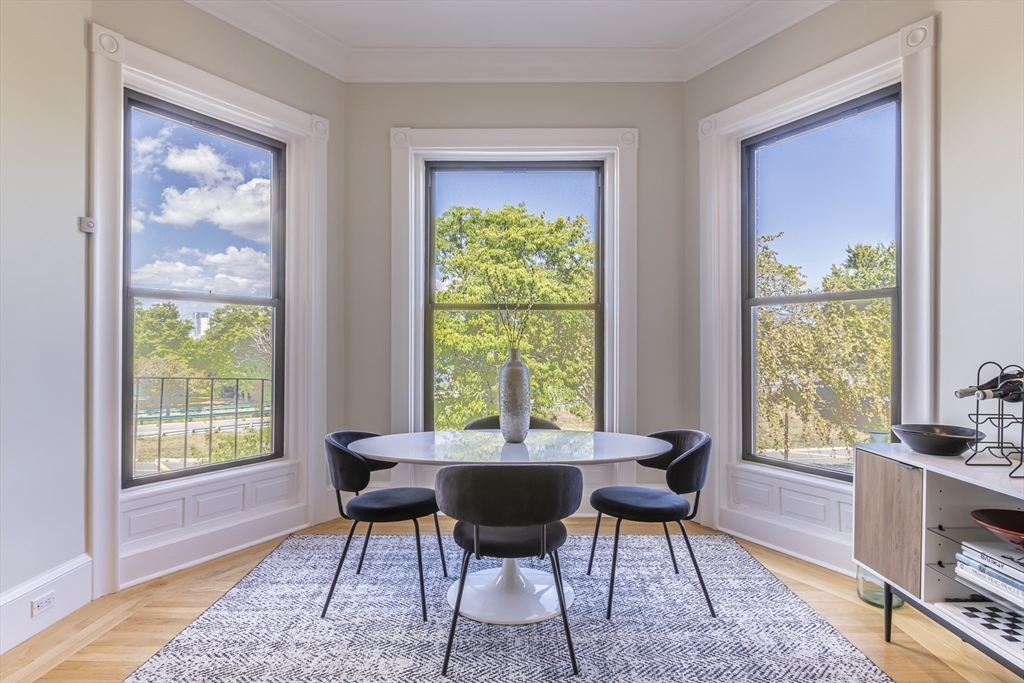 33 Bay State Road, Unit 3 Boston, MA 02215 - Photo 4 of 25 a view of a dining room with furniture window and outside view