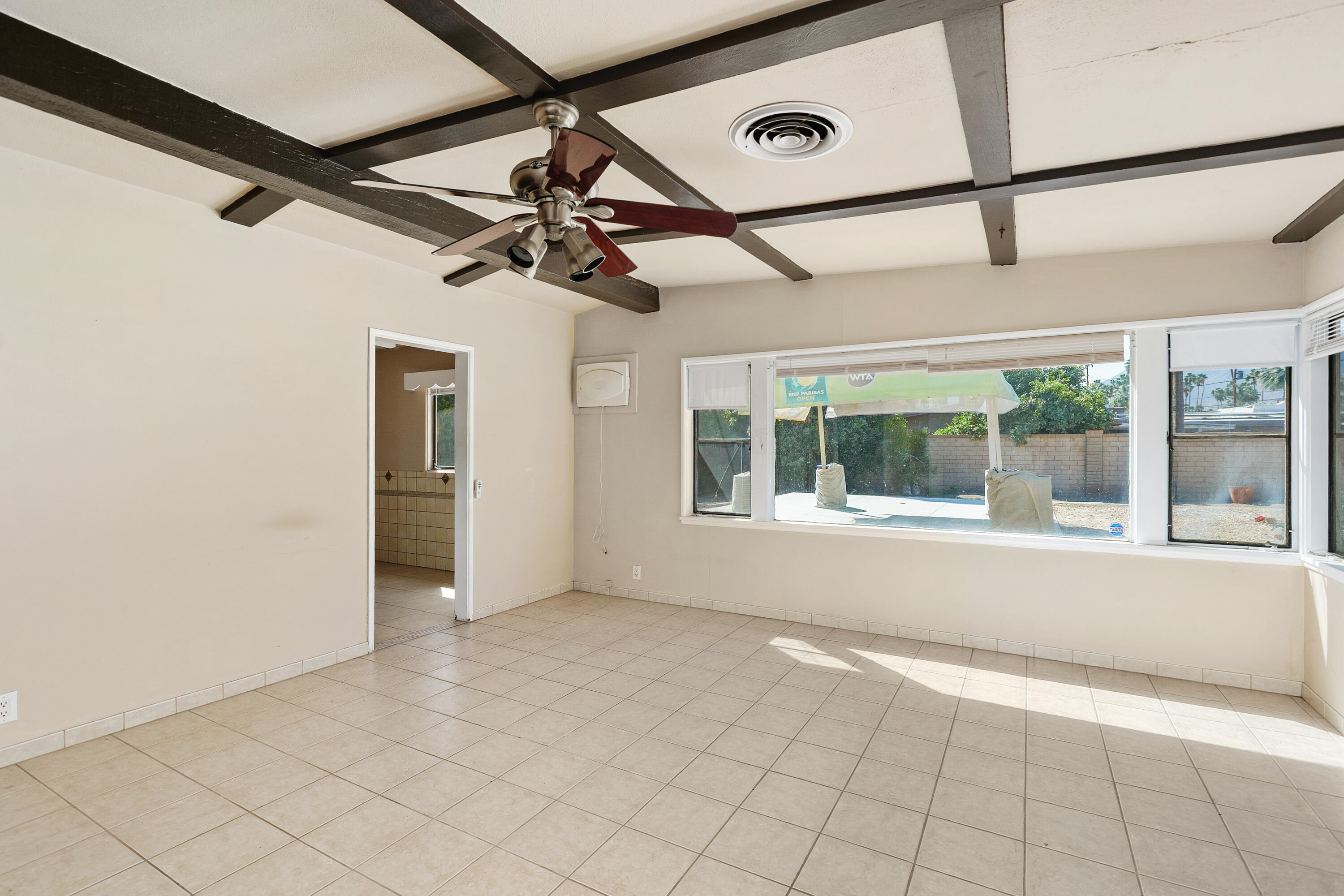 1077 South Riverside Drive Palm Springs, CA 92264 - Photo 12 of 35 a view of an empty room with a window