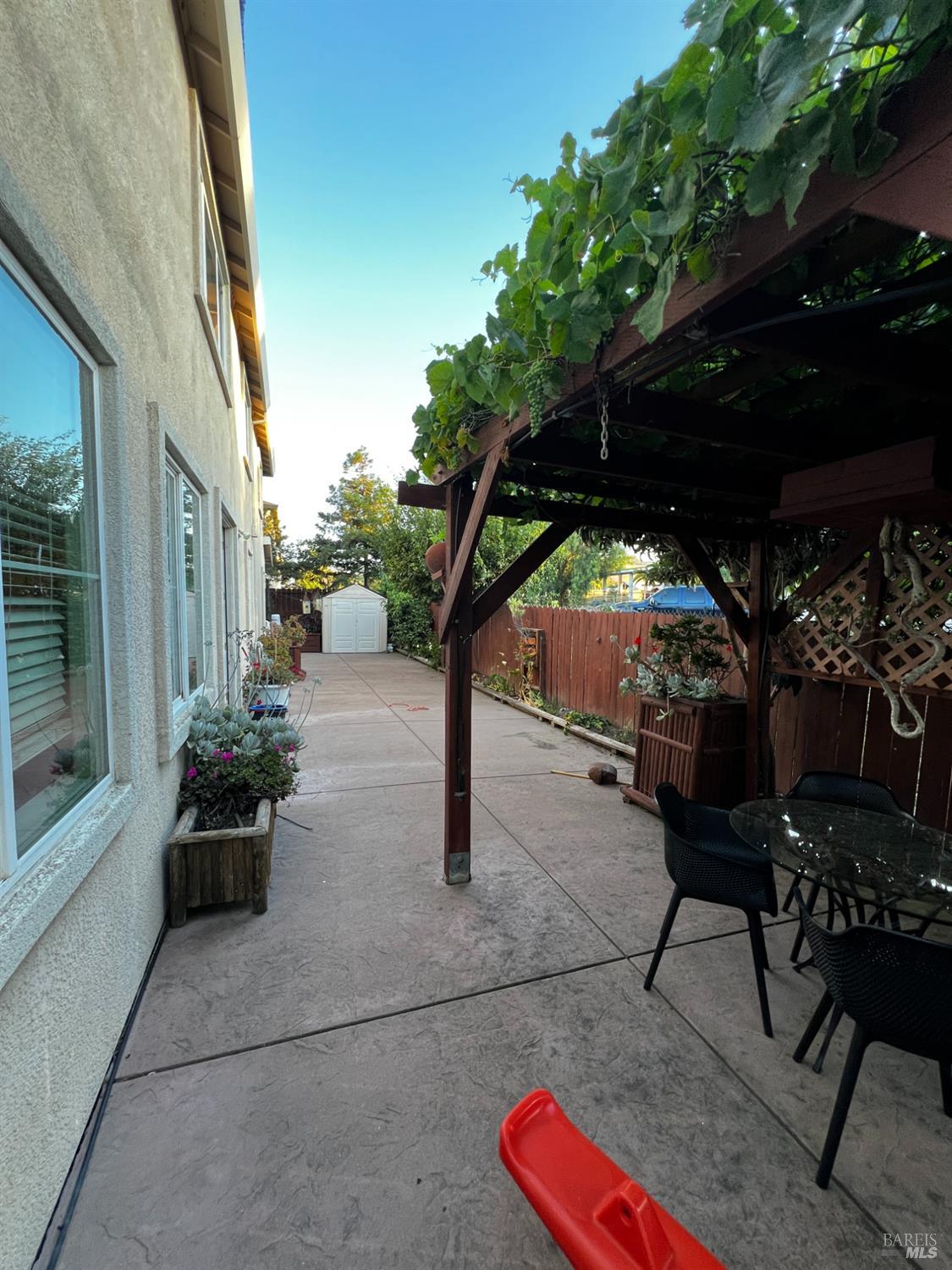 40 Curtis Court Bay Point, CA 94565 - Photo 15 of 18 a patio with table and chairs and potted plants