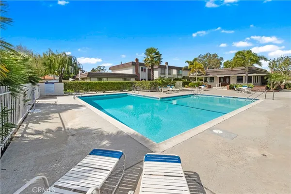 a view of a swimming pool with a patio