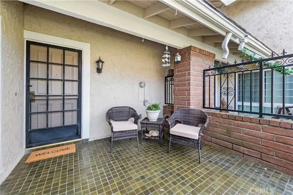 a outdoor living space with furniture and a rug