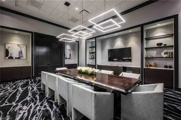 a kitchen with a table and chairs