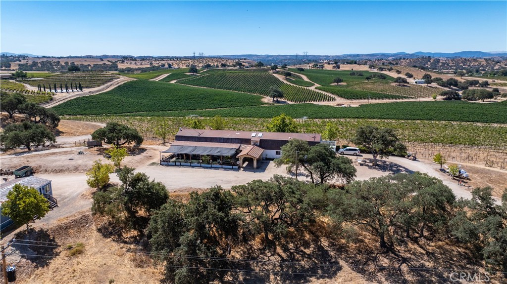 4825 Mill Road Paso Robles, CA 93446 - Photo 11 of 35 an aerial view of a city with lots of residential buildings ocean and mountain view in back