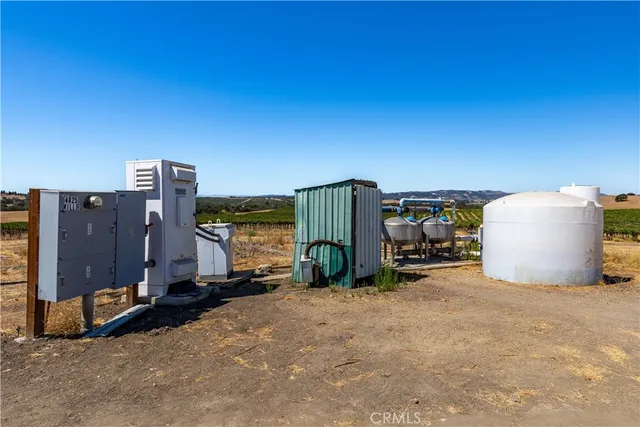 a view of a house with a floor to ceiling window and wooden floor