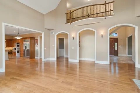 a bathroom with double vanity and a mirror