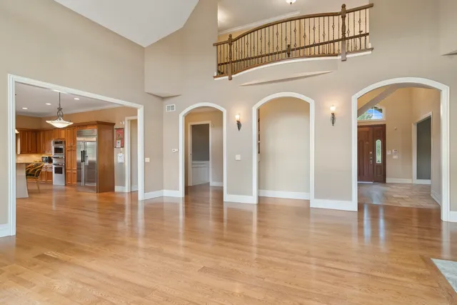 a bathroom with double vanity and a mirror