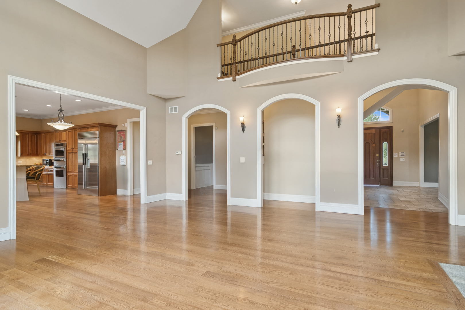 22292 North Prairie Lane Kildeer, IL 60047 - Photo 27 of 85 a view of a hallway with entryway wooden floor and a chandelier