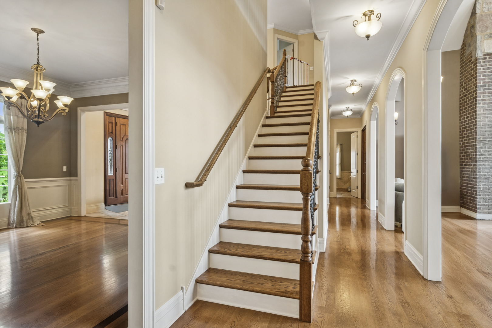 22292 North Prairie Lane Kildeer, IL 60047 - Photo 35 of 85 a view of a hallway with wooden floor and staircase