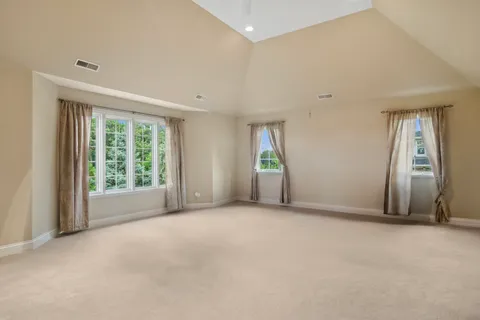 a view of a table and chairs in back yard of the house