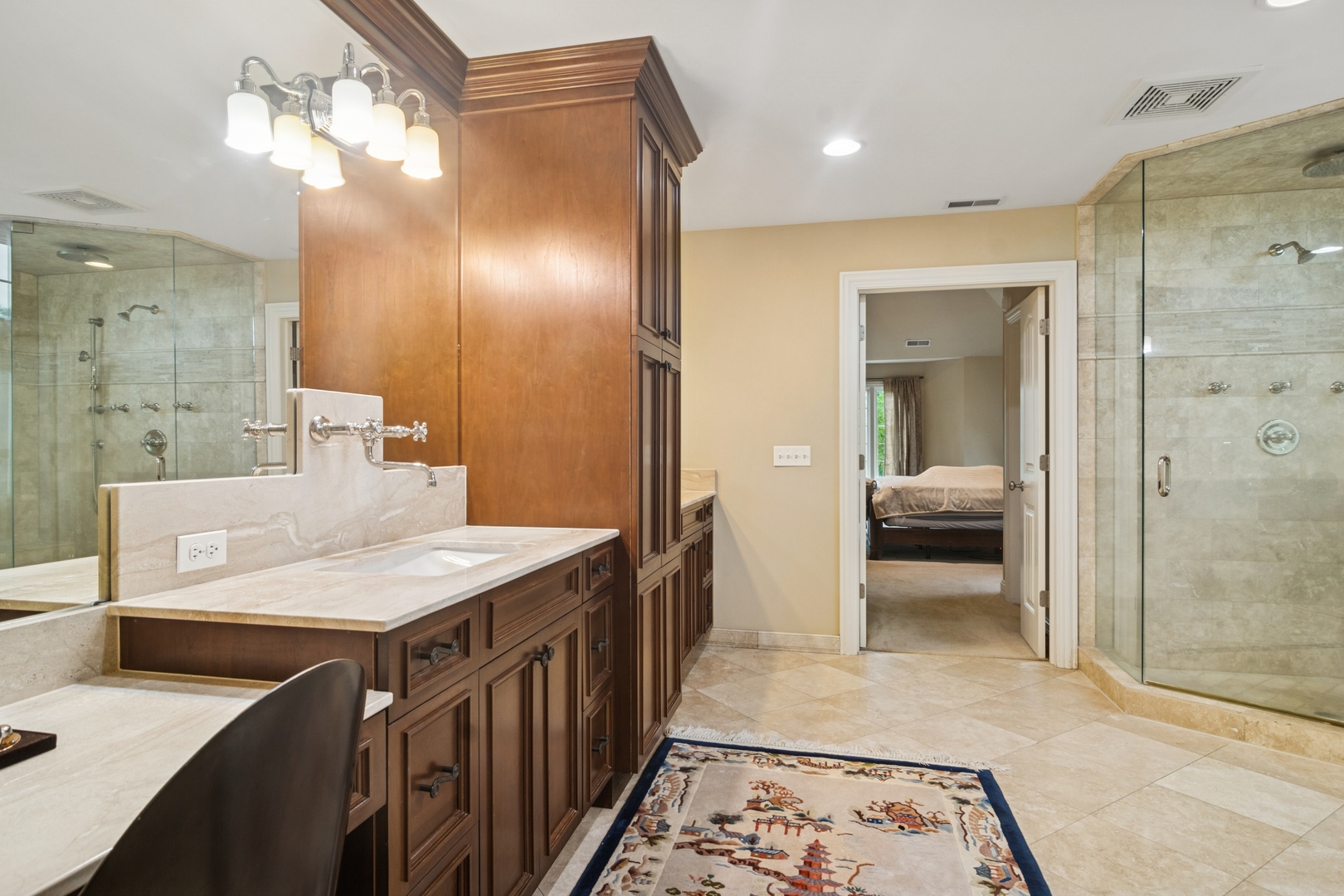 22292 North Prairie Lane Kildeer, IL 60047 - Photo 44 of 85 a en suite bathroom with a sink a mirror and a shower
