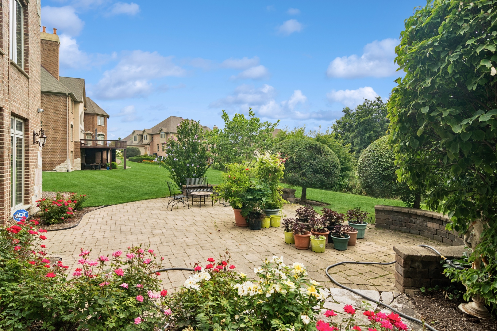 22292 North Prairie Lane Kildeer, IL 60047 - Photo 69 of 85 a view of a table and chairs in back yard of the house