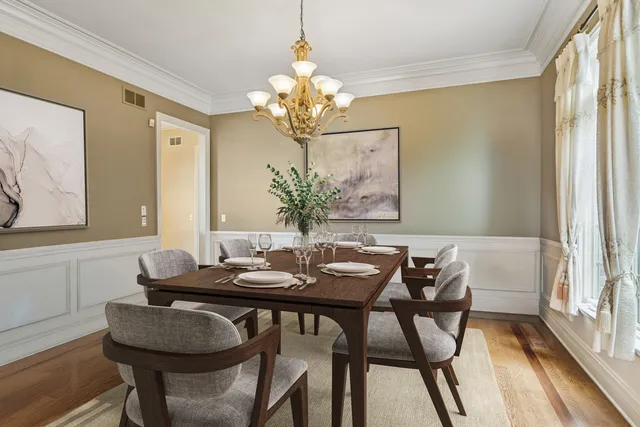 a kitchen with stainless steel appliances kitchen island granite countertop a stove a sink and a wooden cabinets