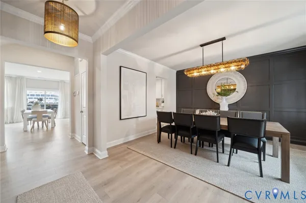 a view of a dining area with furniture and chandelier