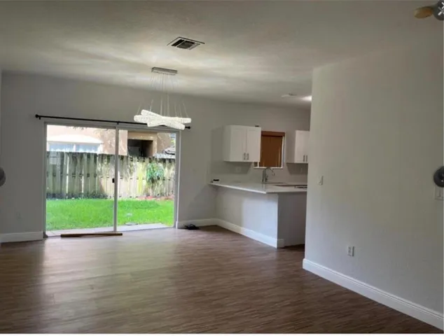 a view of a bathroom with a sink and mirror