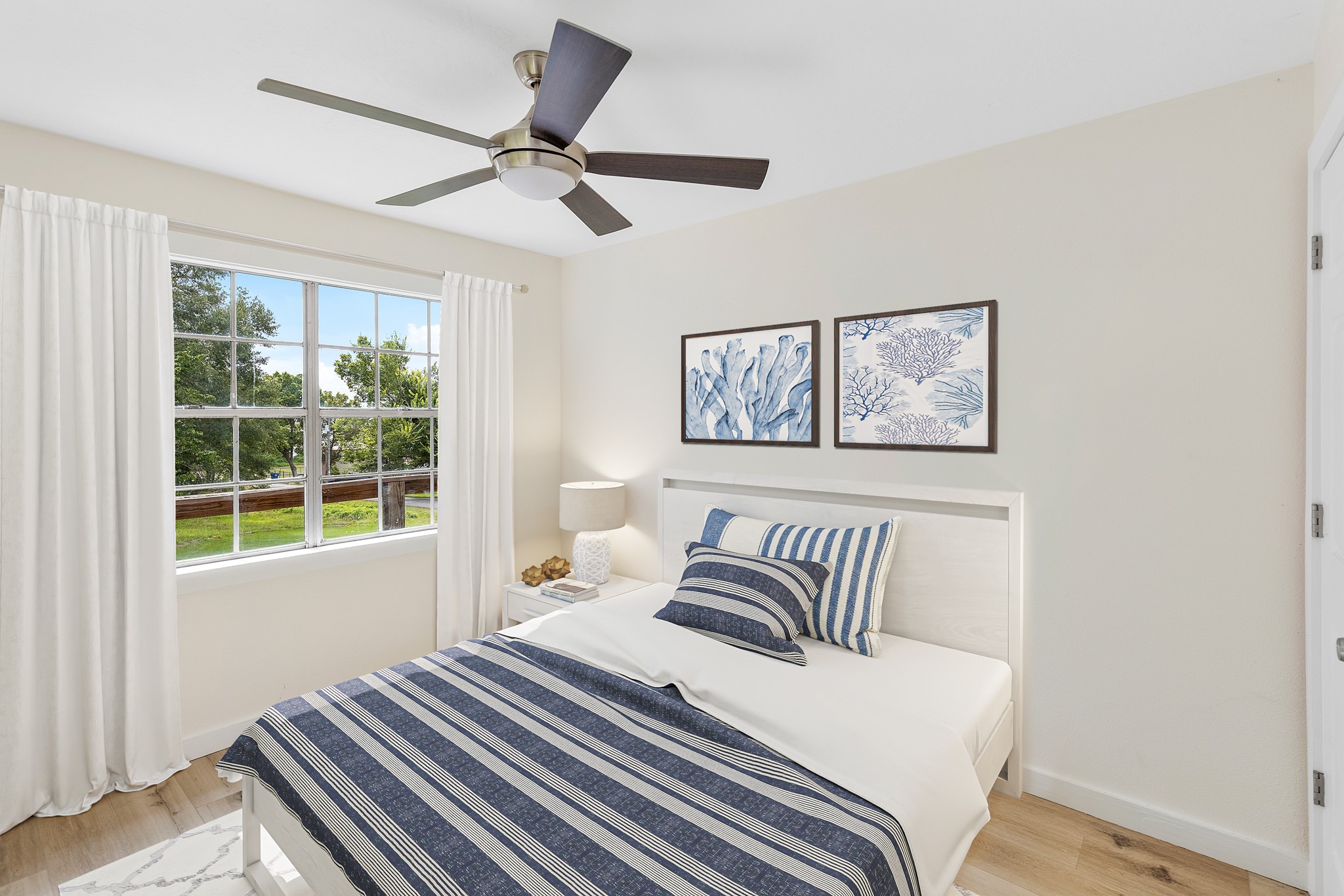 1st bedroom virtually staged. New paint, new flooring, new insulation.