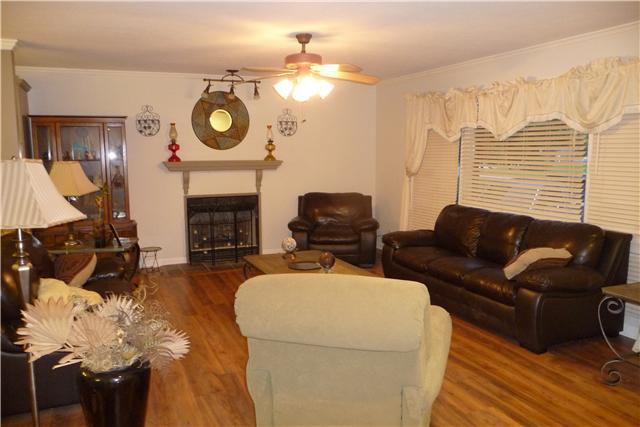 420 Ridgewood Drive Manchester, TN 37355 - Photo 15 of 15 The living room with beautiful laminate floors! Very open floor plan with a gas fireplace to relax by on those chilly evenings.