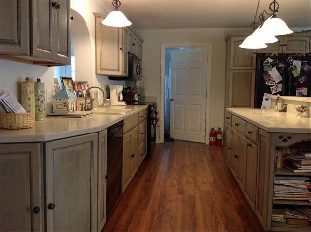 420 Ridgewood Drive Manchester, TN 37355 - Photo 3 of 15 The beautiful kitchen with corian counters and lots of storage. The other side of the counter is a full bar seating area.
