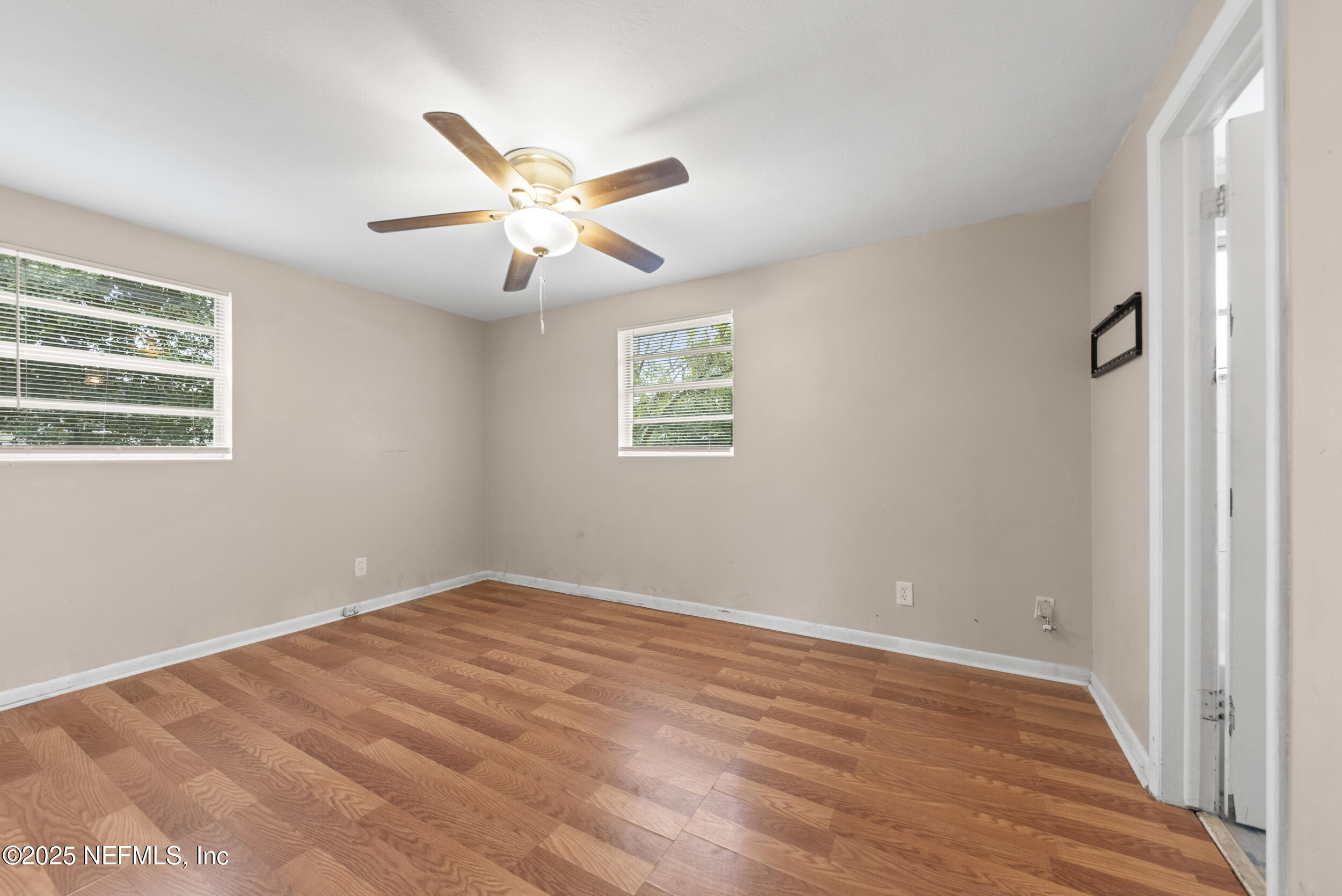 5646 Ricker Road Jacksonville, FL 32244 - Photo 13 of 27 a view of an empty room with a window