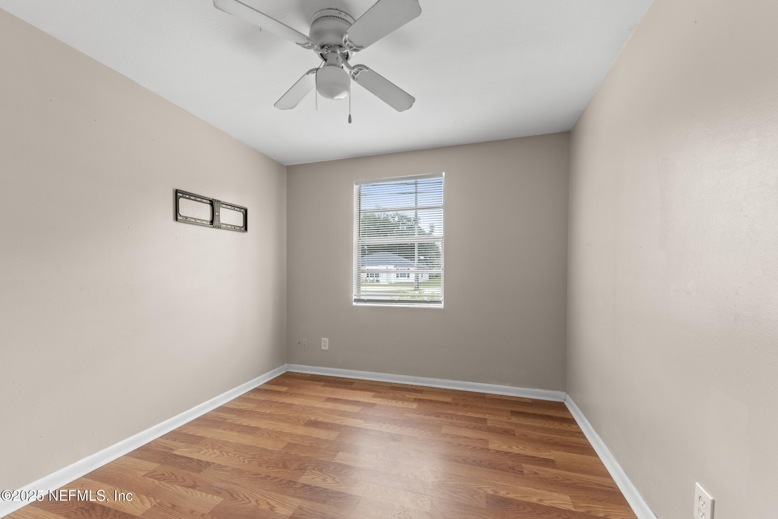 5646 Ricker Road Jacksonville, FL 32244 - Photo 18 of 27 a view of an empty room with a window