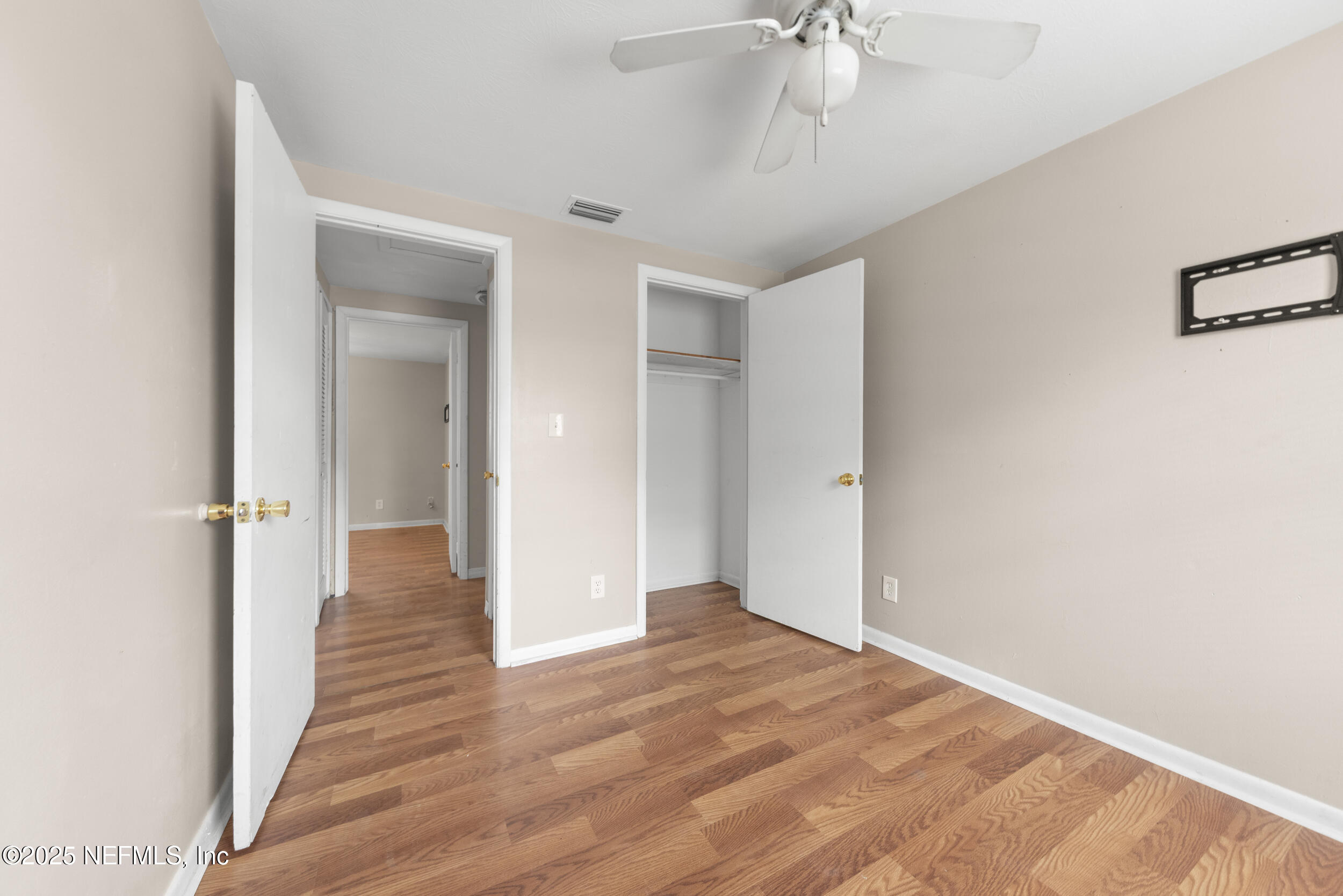 5646 Ricker Road Jacksonville, FL 32244 - Photo 19 of 27 a view of a hallway with wooden floor