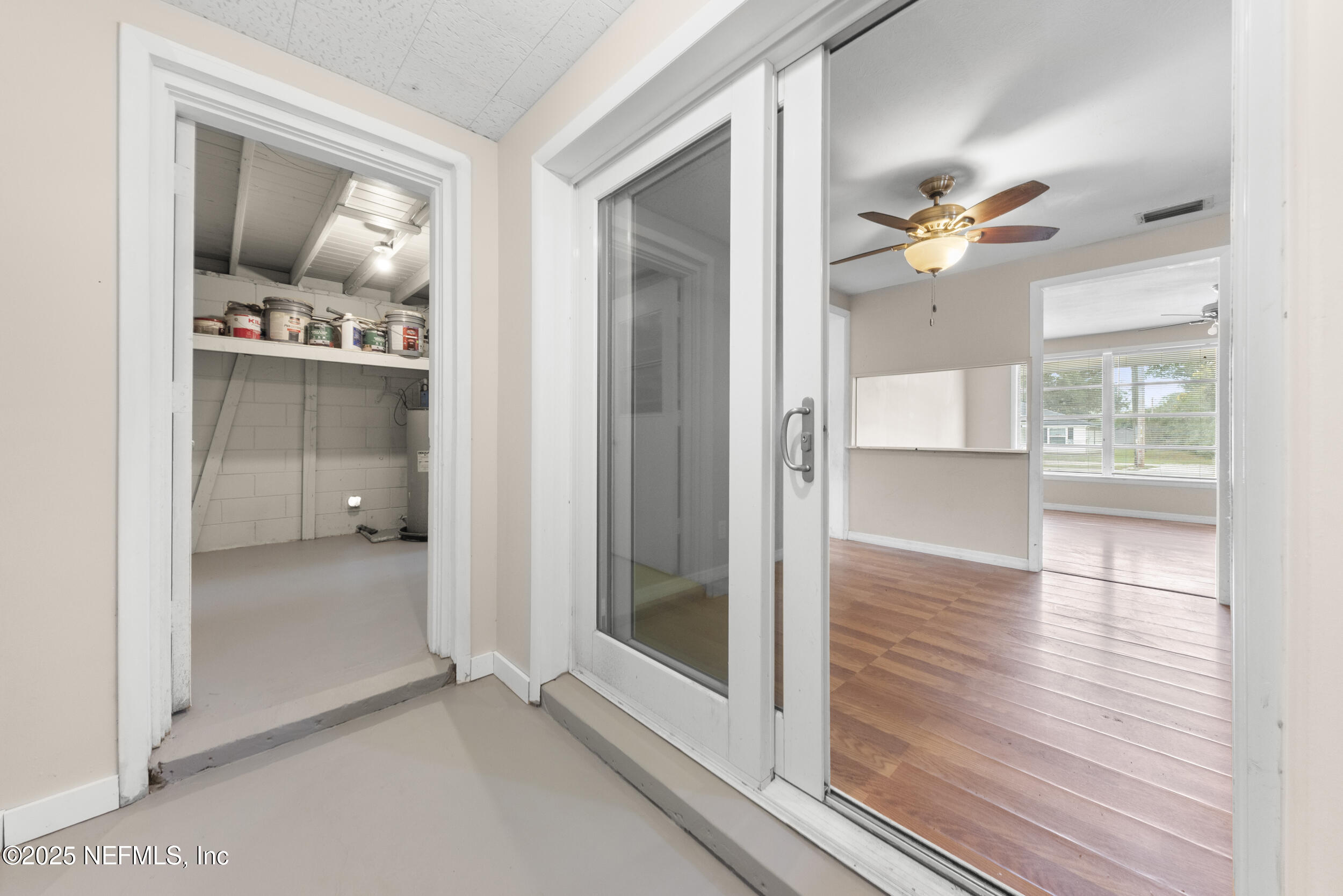 5646 Ricker Road Jacksonville, FL 32244 - Photo 20 of 27 wooden floor in an empty room and a window