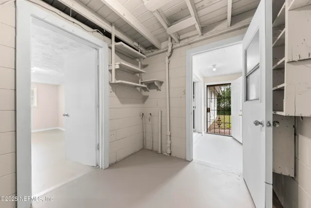 a view of an empty room with a window