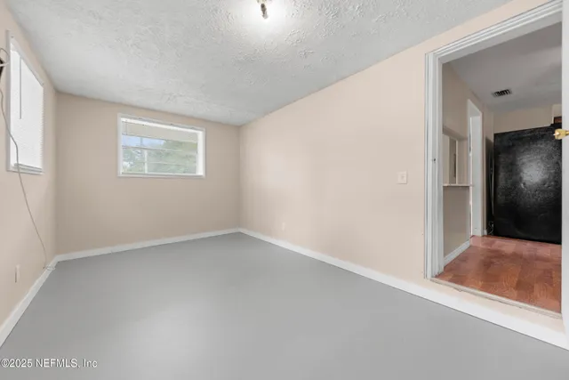 a view of a yard with a tree