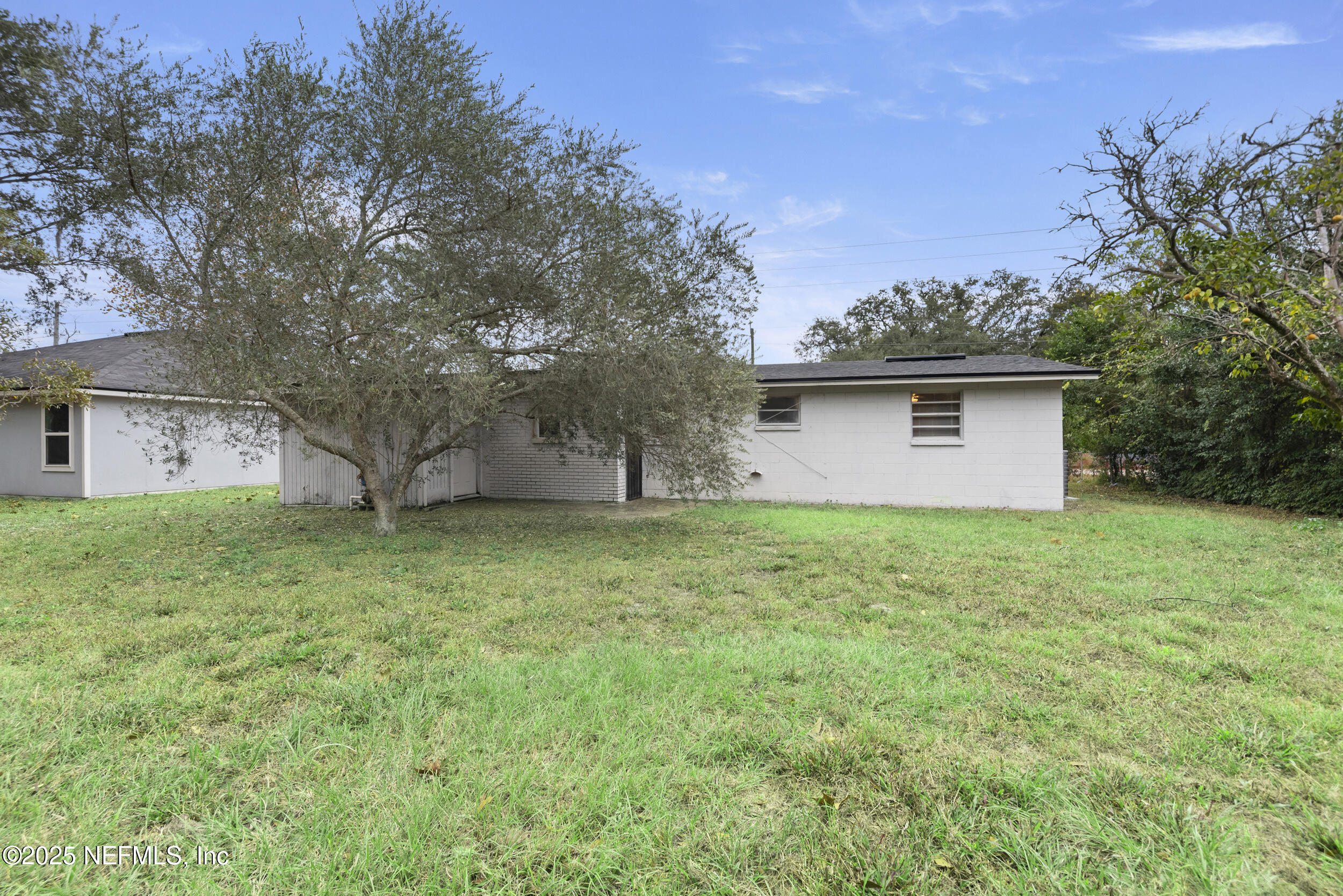 5646 Ricker Road Jacksonville, FL 32244 - Photo 27 of 27 a view of a house with a yard