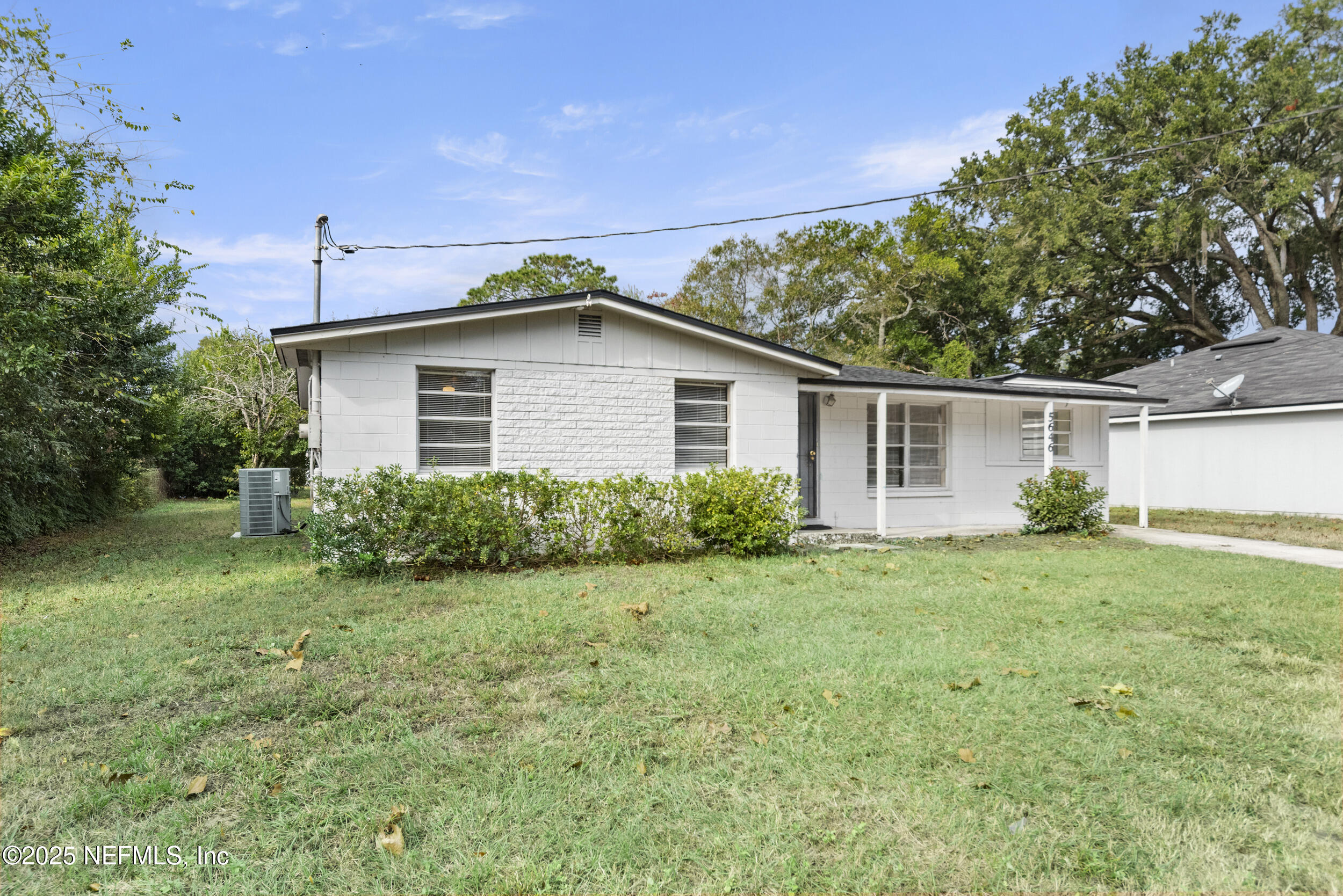5646 Ricker Road Jacksonville, FL 32244 - Photo 3 of 27 a front view of a house with a yard