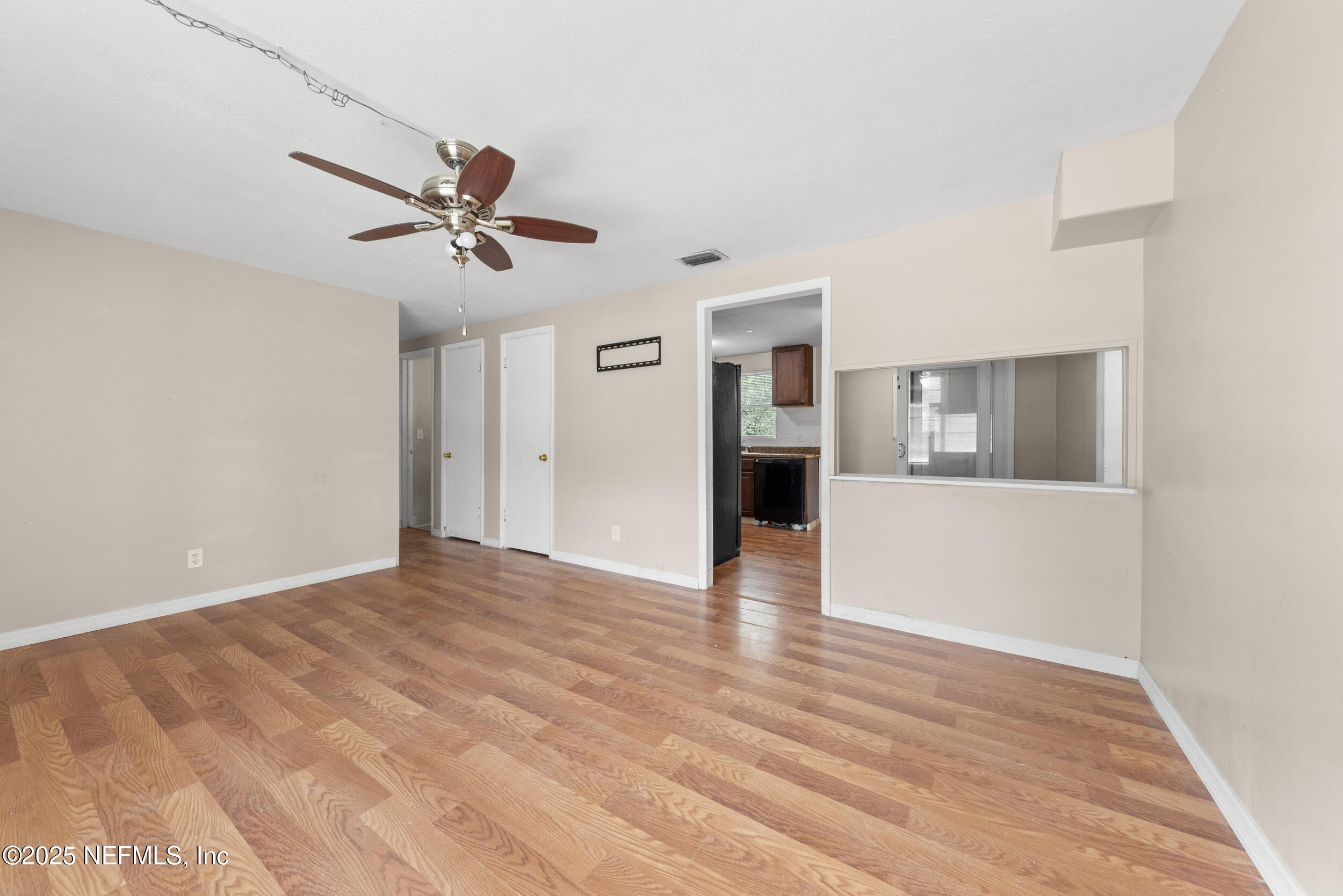 5646 Ricker Road Jacksonville, FL 32244 - Photo 7 of 27 a view of an empty room with a window