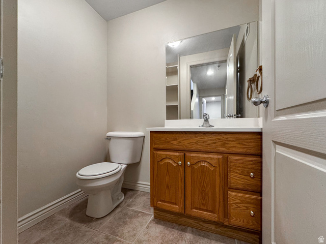 7936 Wycliffe Way Eagle Mountain, UT 84005 - Photo 20 of 37 Bathroom featuring vanity and light tile patterned floors