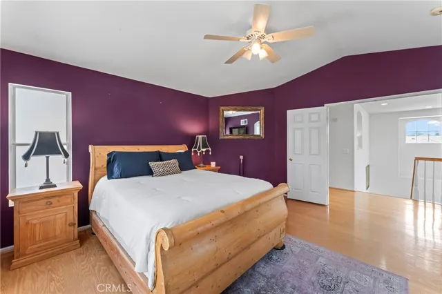 a bed room with a bed and a chandelier