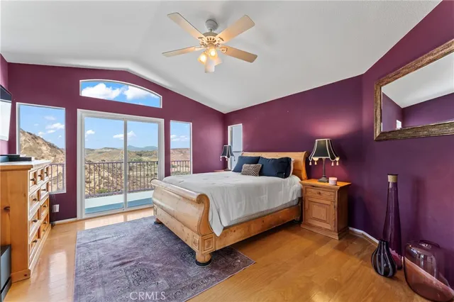 a spacious bedroom with a bed and window