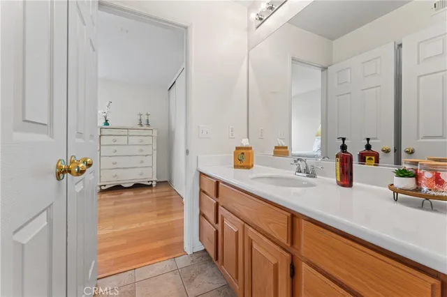 a kitchen with kitchen island a sink stainless steel appliances and cabinets