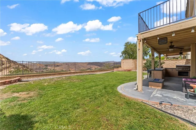 a view of a swimming pool with a yard