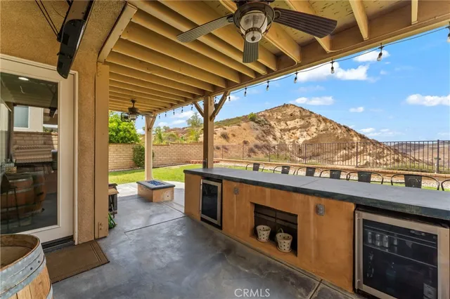 a view of a patio with a table and chairs