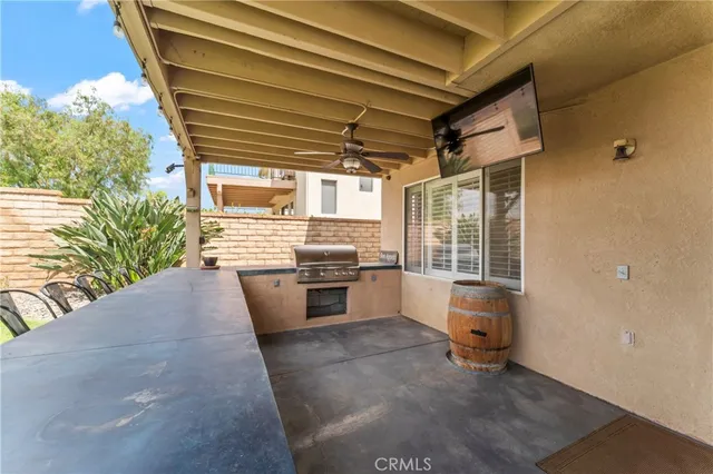 a kitchen with granite countertop a stove and a refrigerator