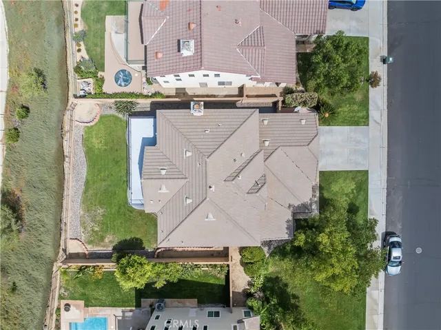an aerial view of a house with a garden